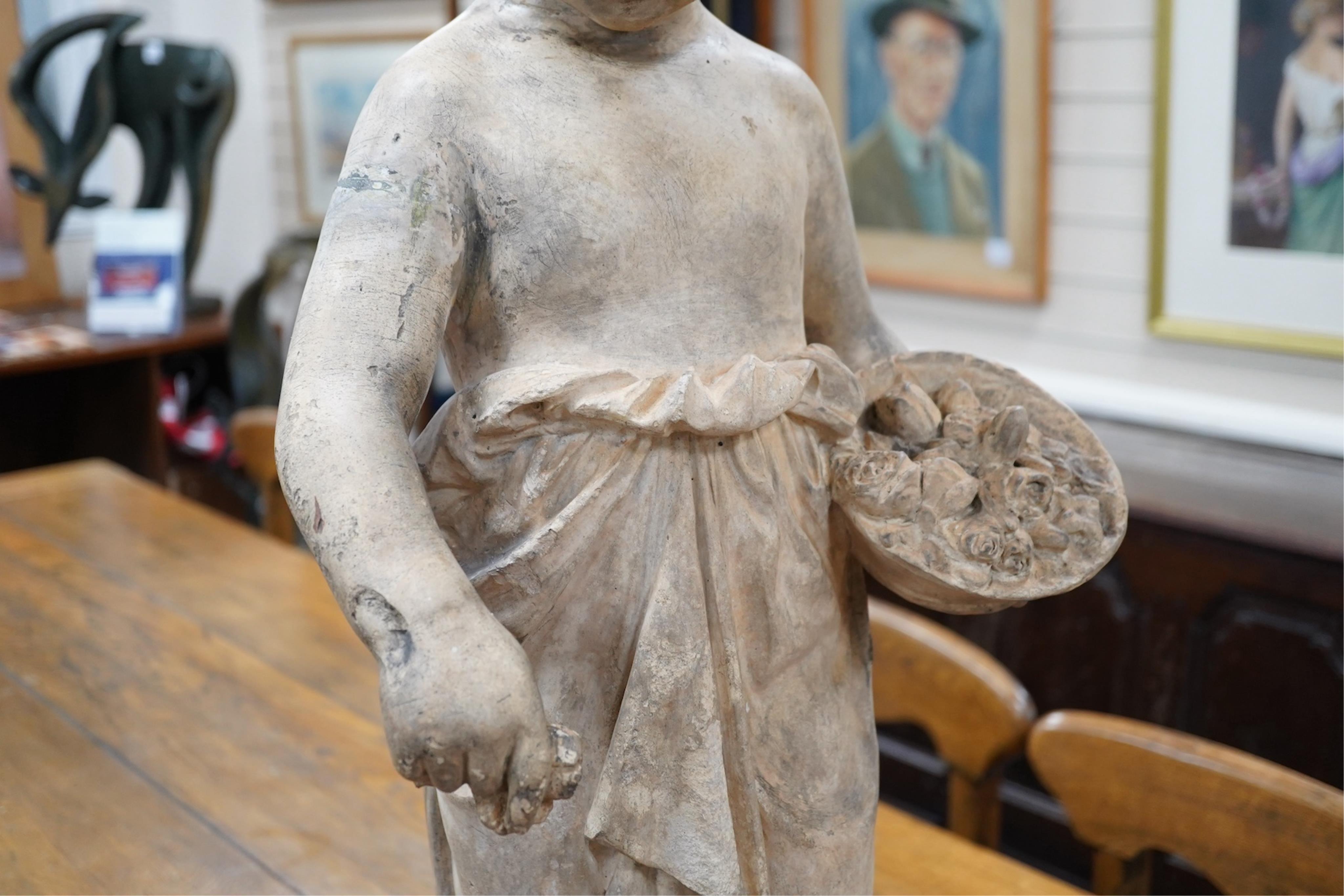 A large terracotta figure of a flower maiden, emblematic of summer, 80cm tall. Condition - repaired